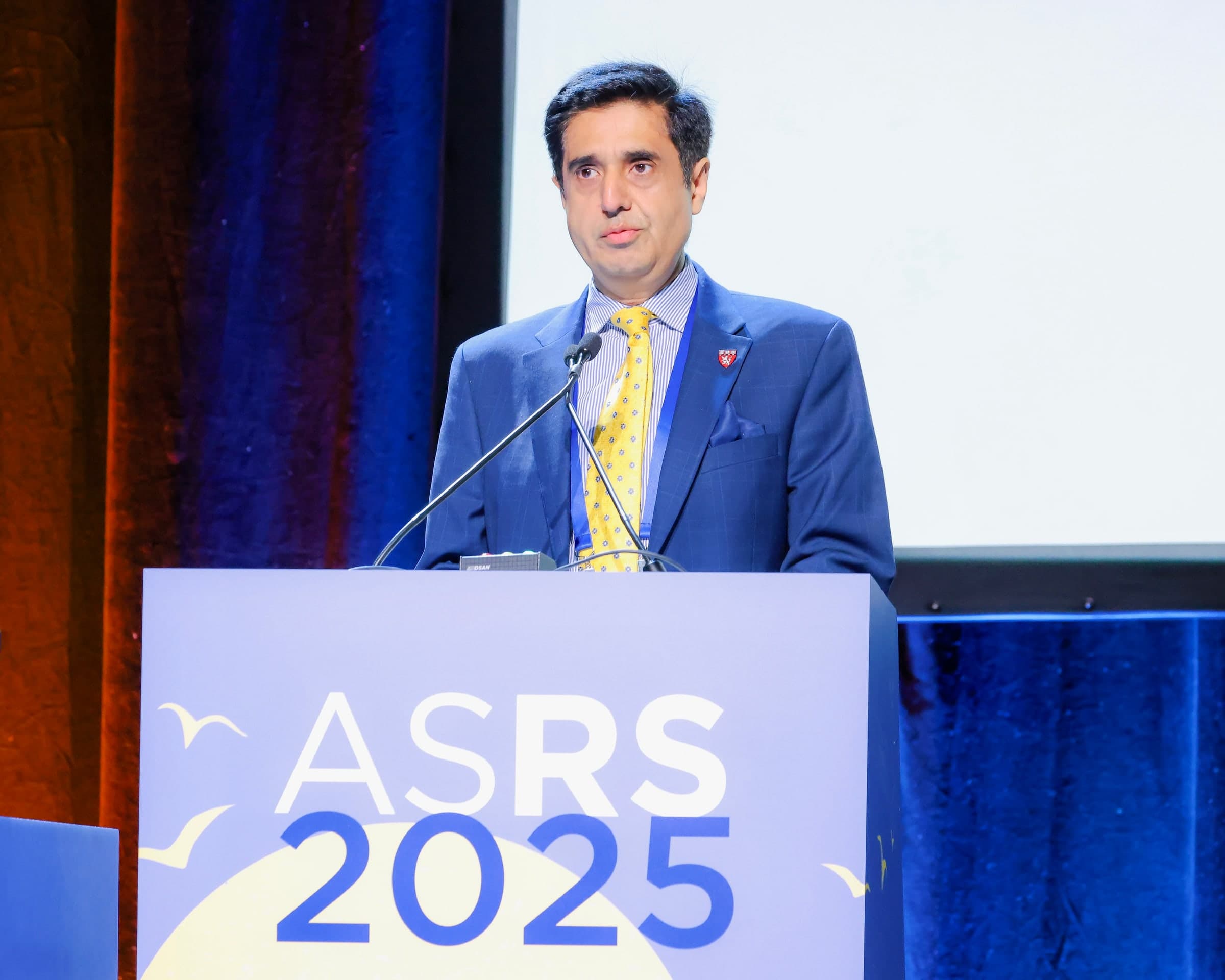 Prof. Dr. Amer Awan speaking at the ASRS 2025 meeting