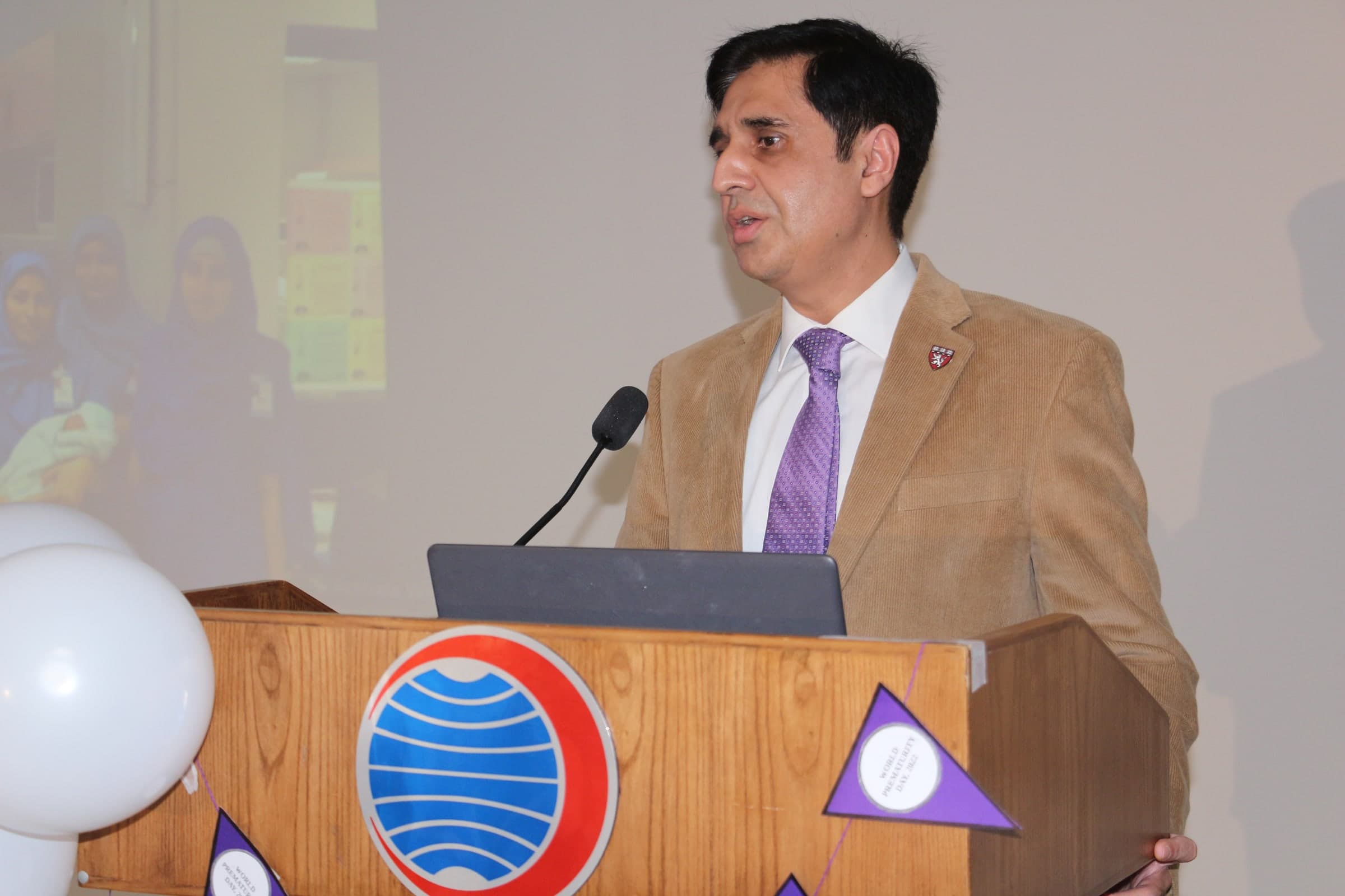 Prof. Dr. Amer Awan speaking at a professional research meeting